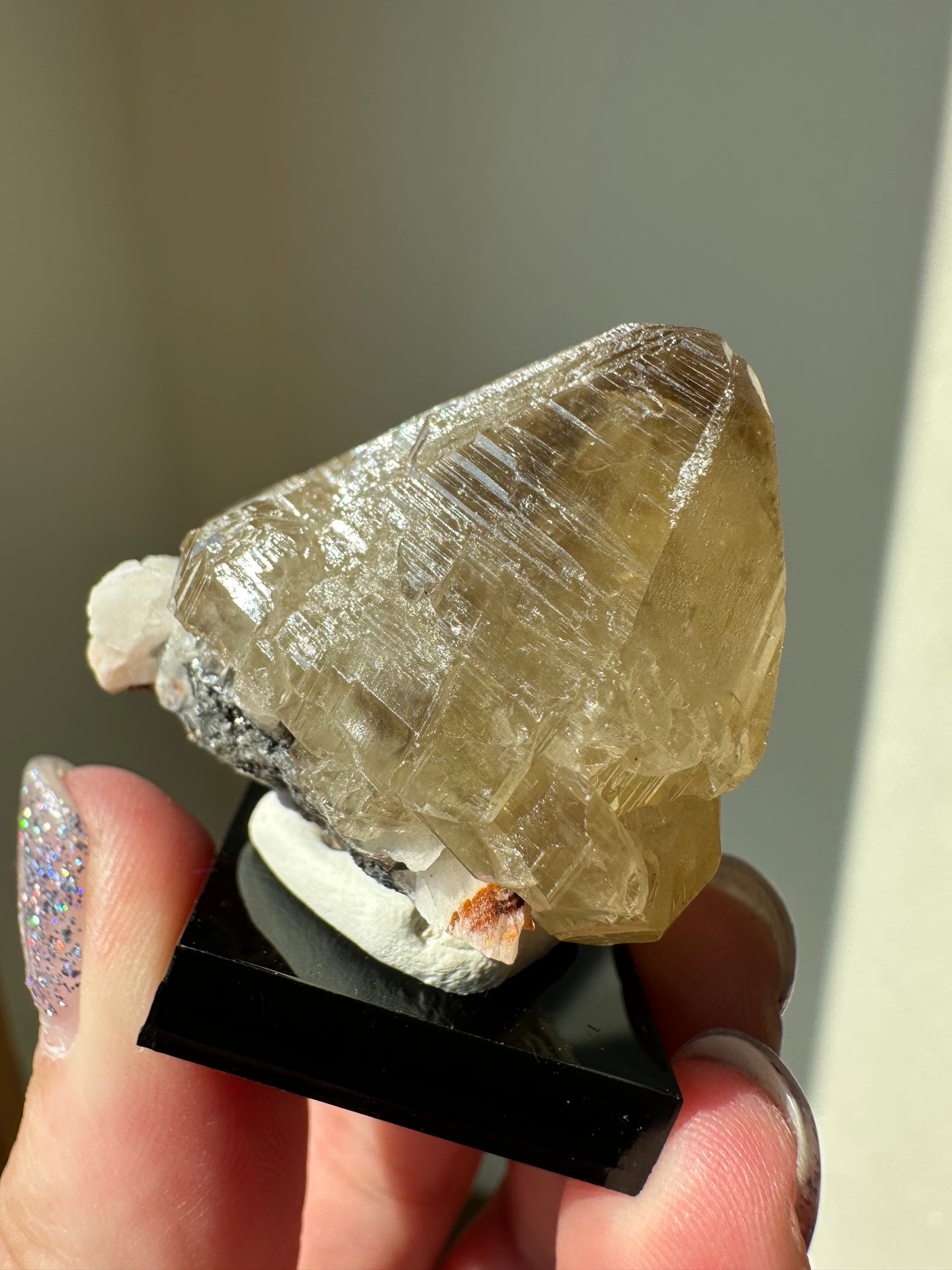 Cerussite: etched point with phantoms