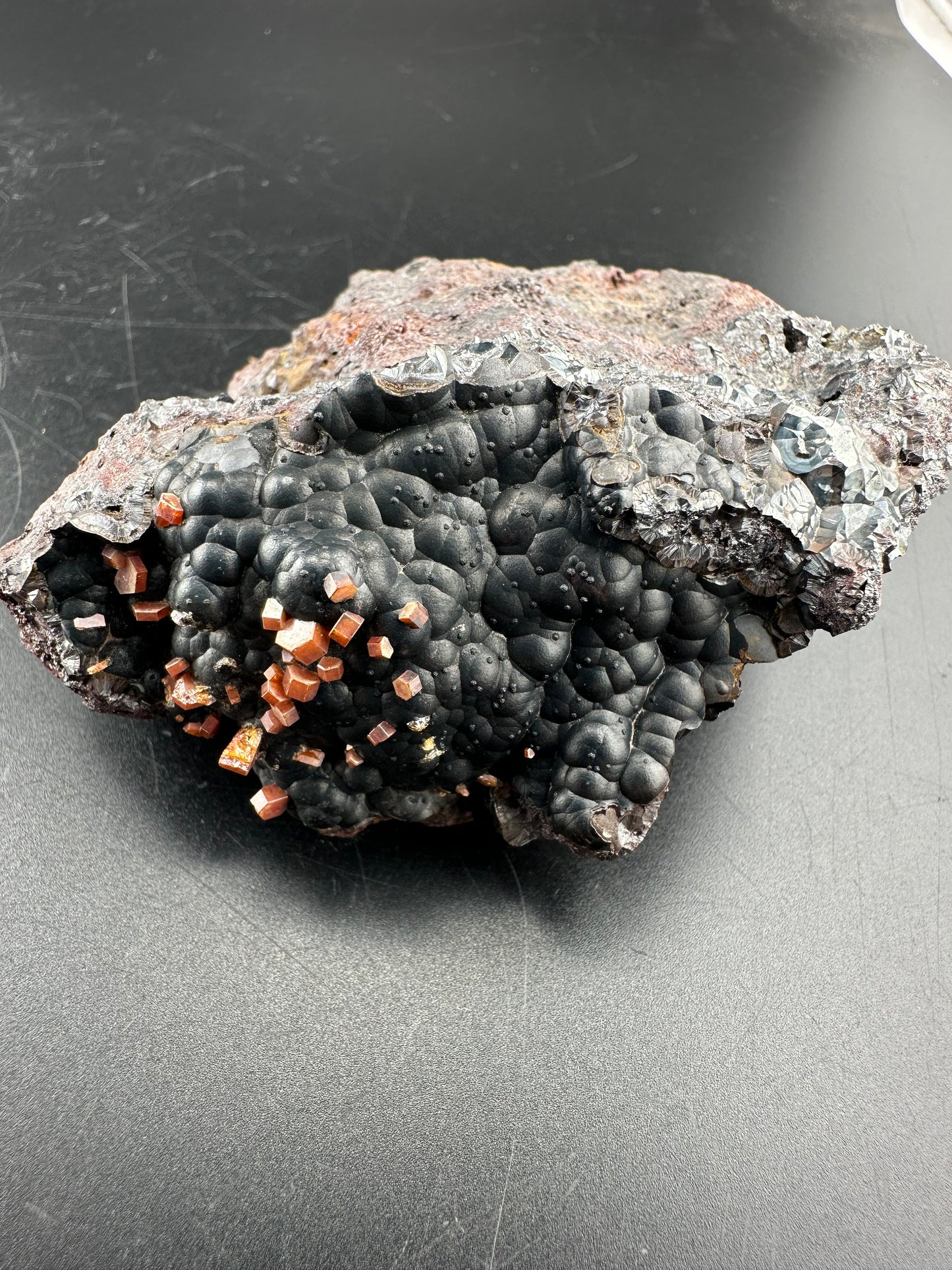 Vanadinite on botryoidal hematite: Morocco
