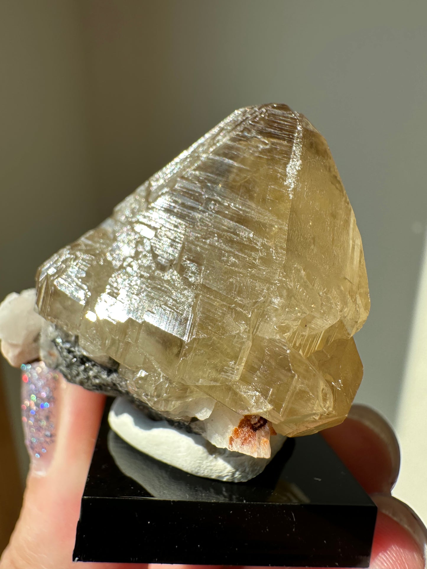 Cerussite: etched point with phantoms