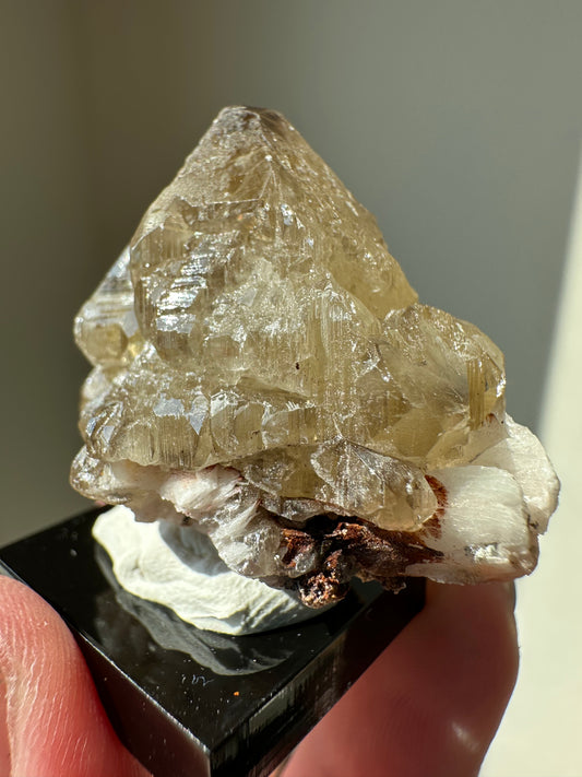 Cerussite: etched point with phantoms